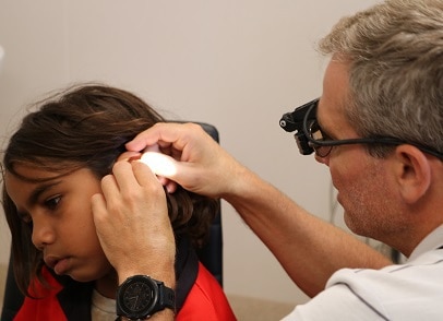 Ear Science Doctor Performing Hearing Check