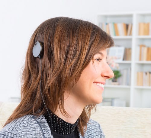 Woman showing cochlear implant