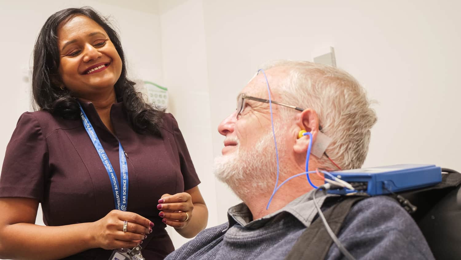 Audiologist Testing Hearing Device