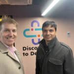 Dr. David Sly and Prof. Sharath Sriram posing for a picture outside the Discovery to Device Facility.